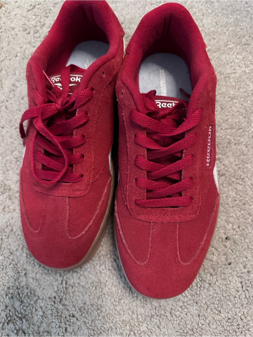 Reebok women’s red Suede Low-Top Sneakers